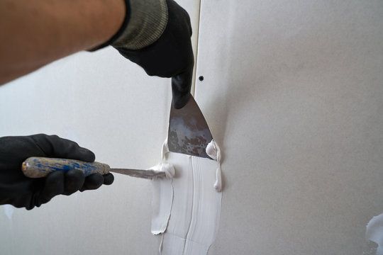 Drywall repair preparation before painting