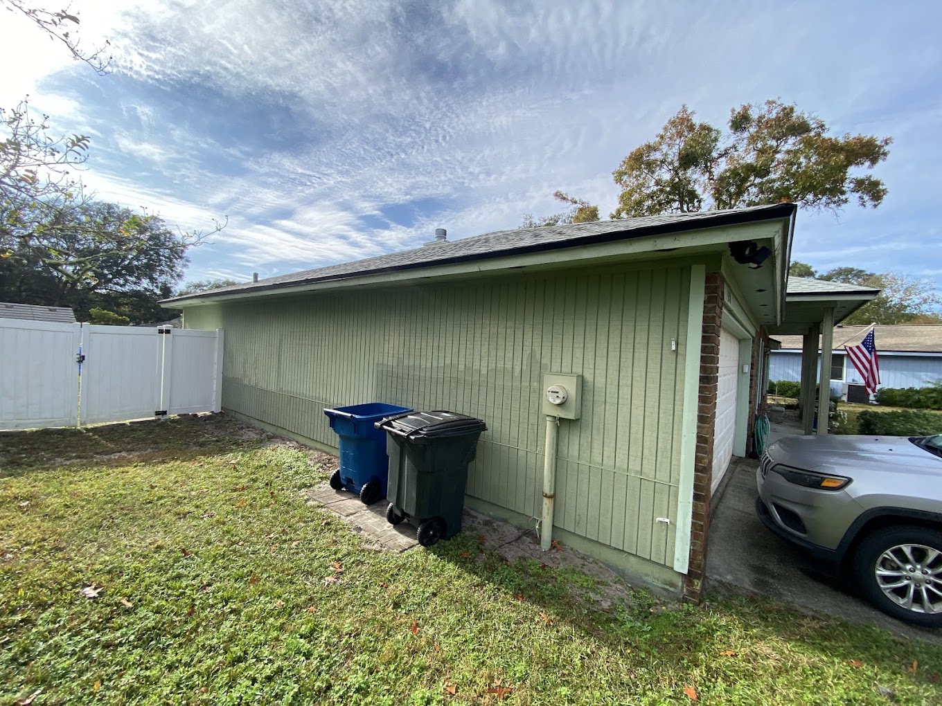 Green home exterior with refreshed siding and trim